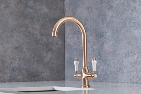 A copper tap in a modern bright kitchen.